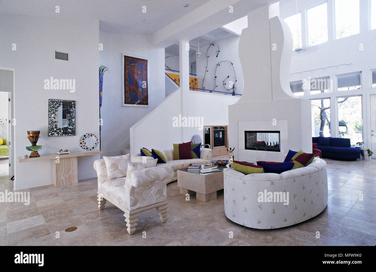 Spacious Contemporary Sitting Room With White Walls Patterned
