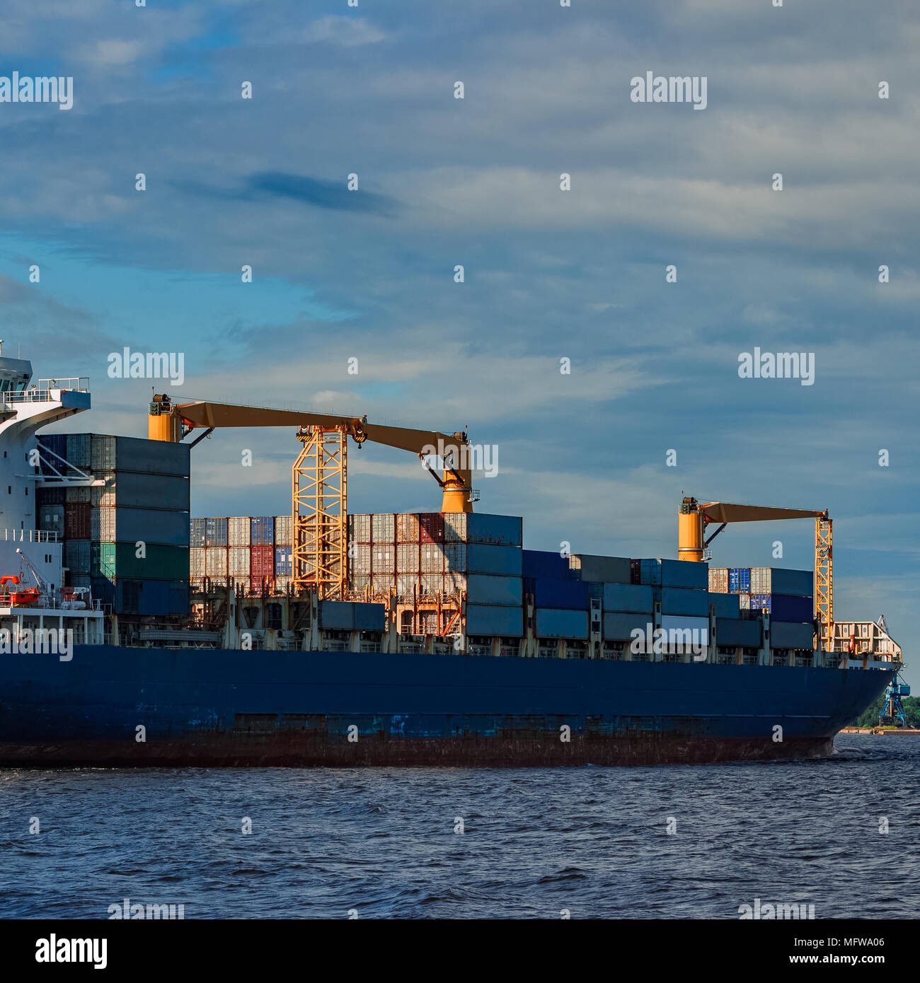 Blue container ship. World logistics and production transfer Stock