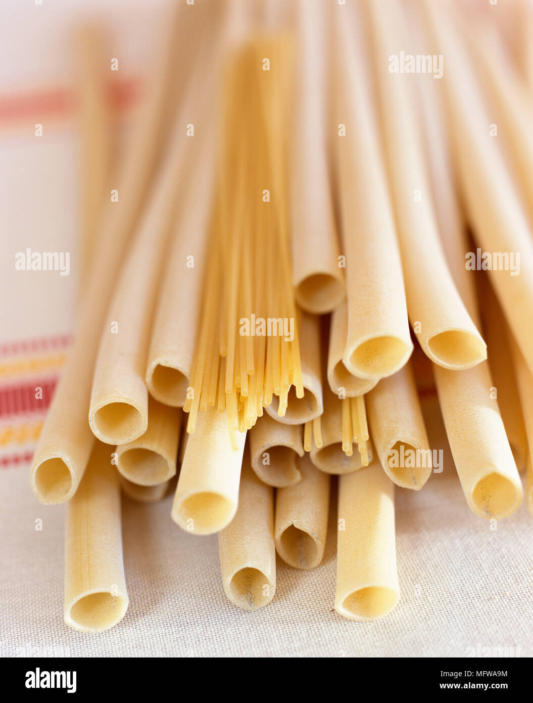 Dried pasta tubes and spaghetti Stock Photo