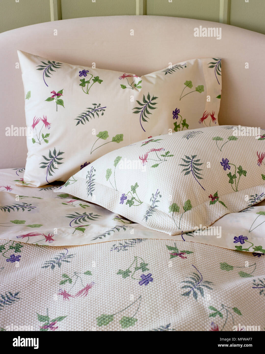 Floral pattern bed linen on bed Stock Photo Alamy