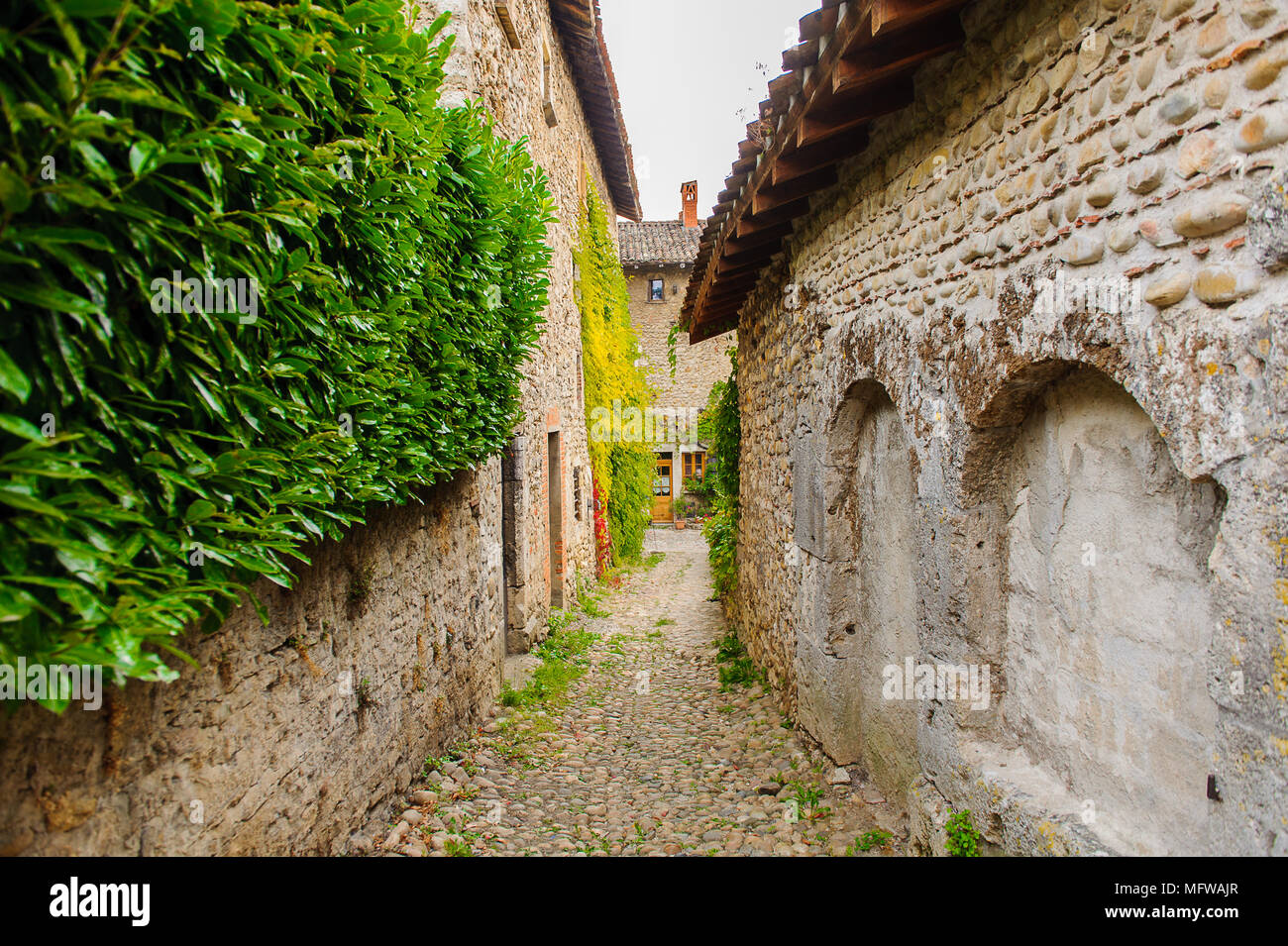 Narrow street in Perouges, France, a medieval walled town, a popular ...