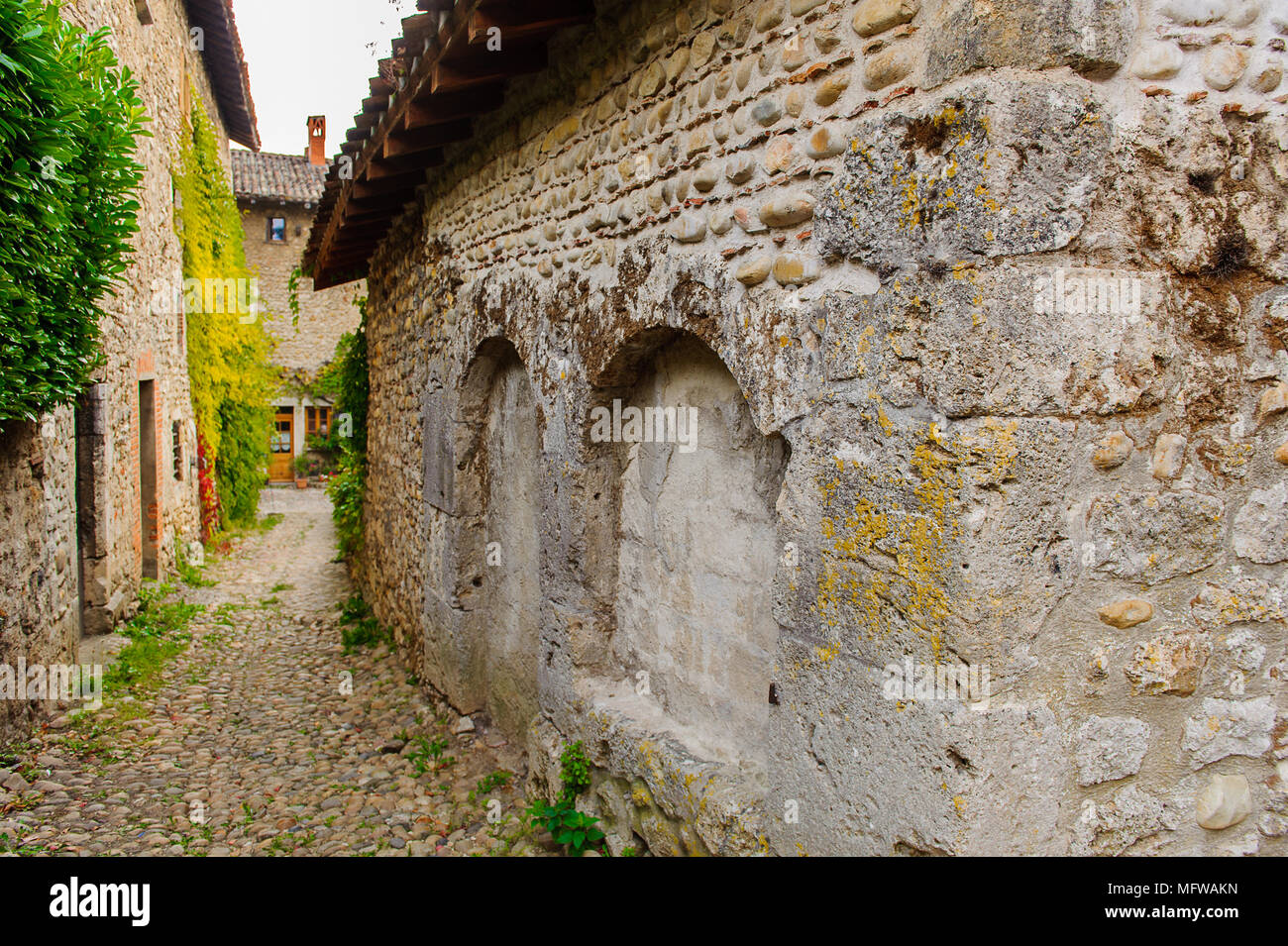 Narrow street in Perouges, France, a medieval walled town, a popular ...
