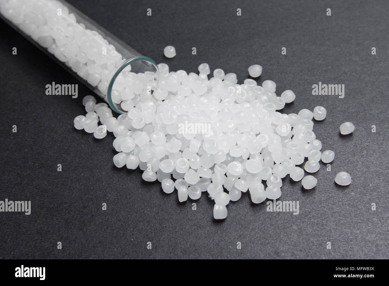 Plastic pellets. Transparent Polyethylene granules. Plastic Raw material .High Density Polyethylene (PE-HD).  PE-LD Stock Photo