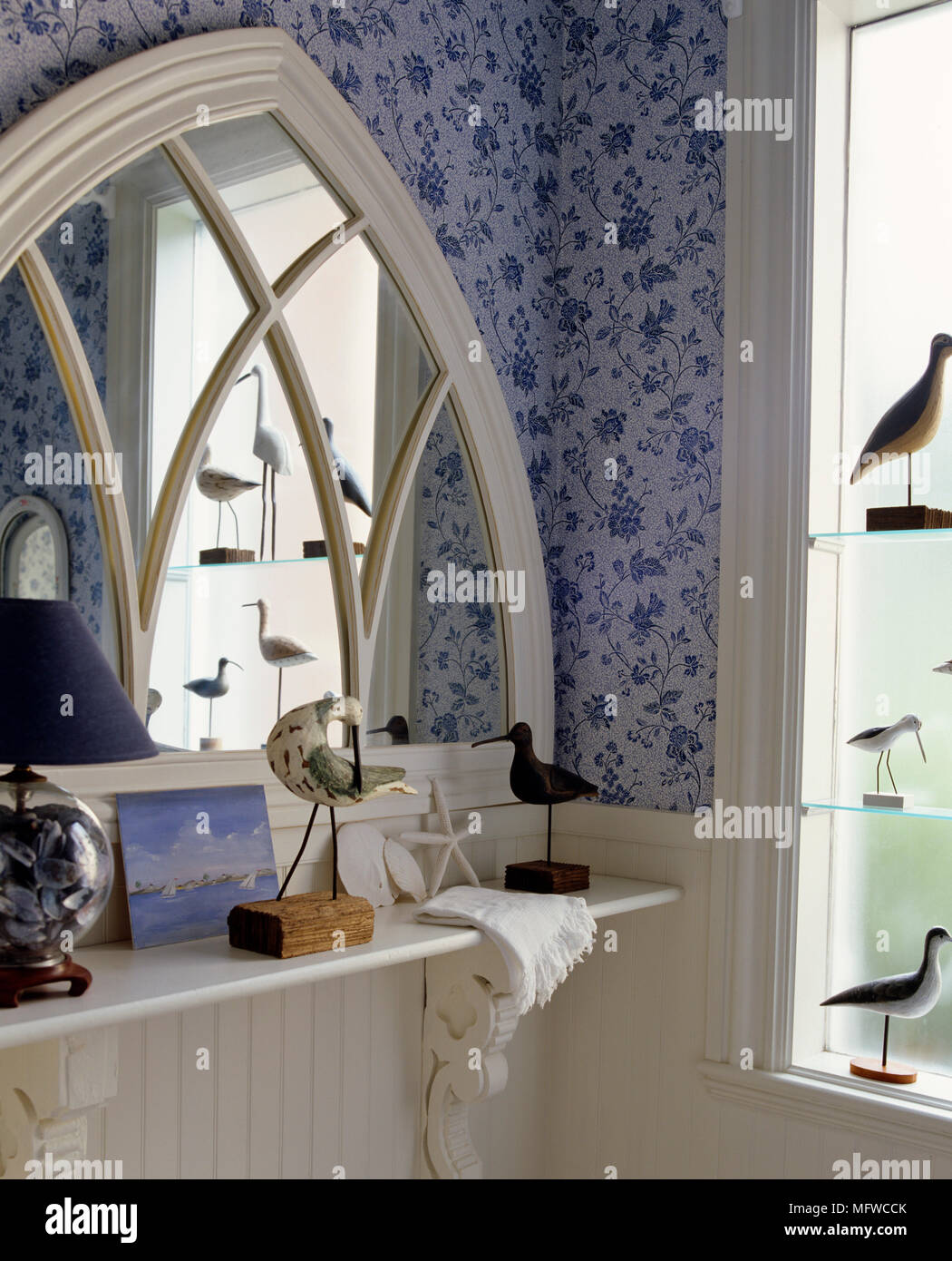 Gothic Style Mirror Above Shelf In Corner Of Room Stock Photo