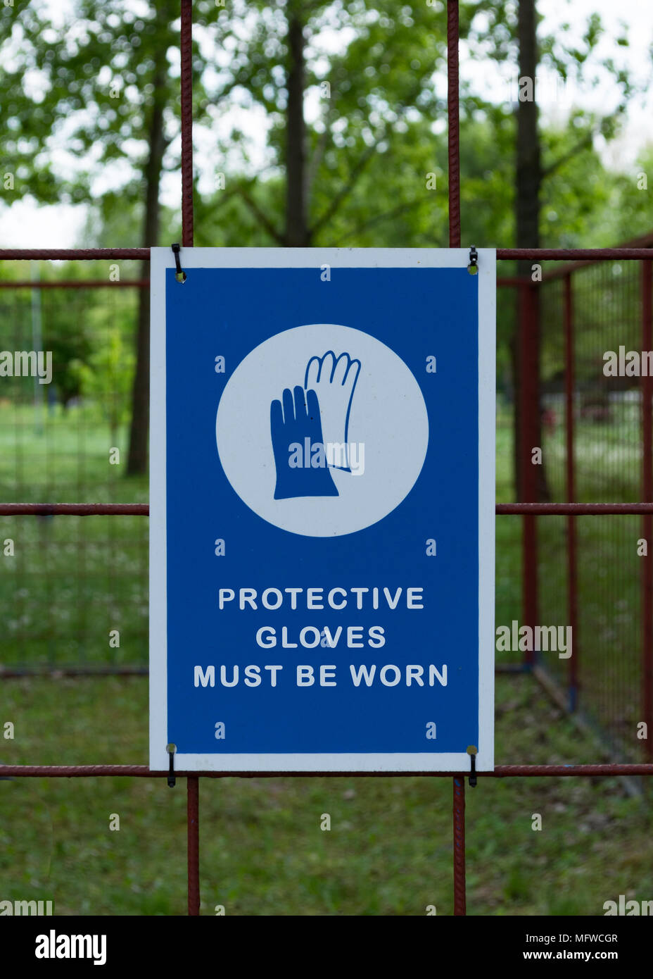 Protective safety gloves must be worn, mandatory sign. Stock Photo