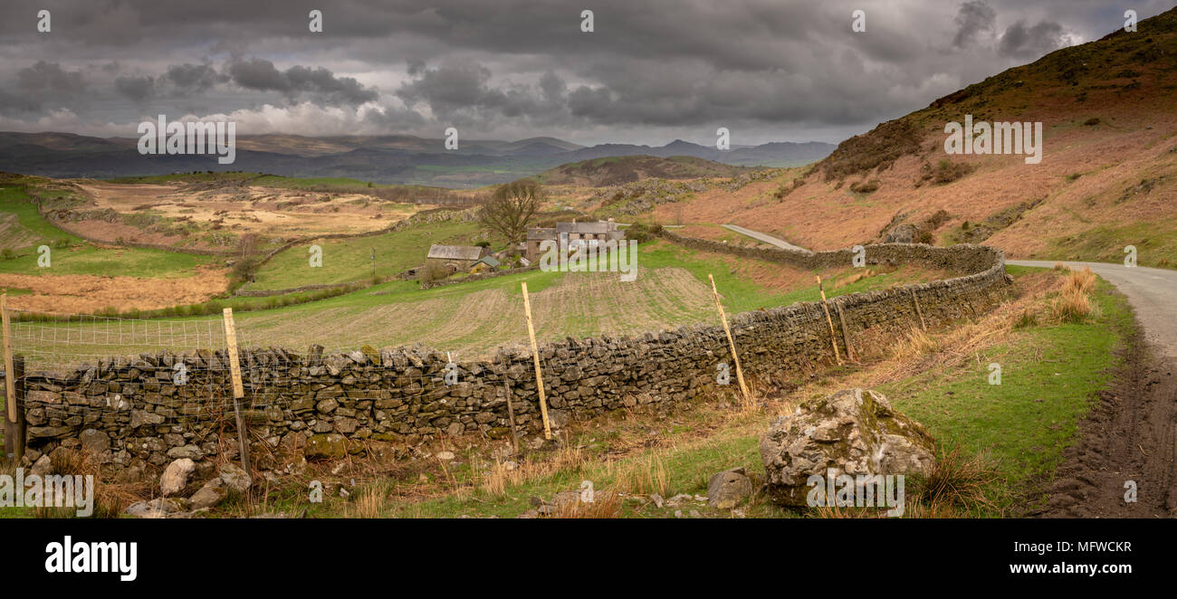 Burney on Kirkby Moor in Cumbria.  This old farm is tucked into the landscape which protects it from the weather as it sweeps in from the west. Stock Photo