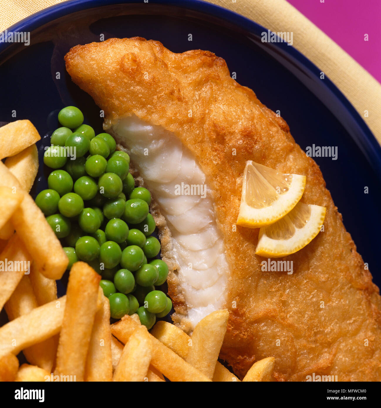 Fish and chips with battered cod and peas Stock Photo - Alamy