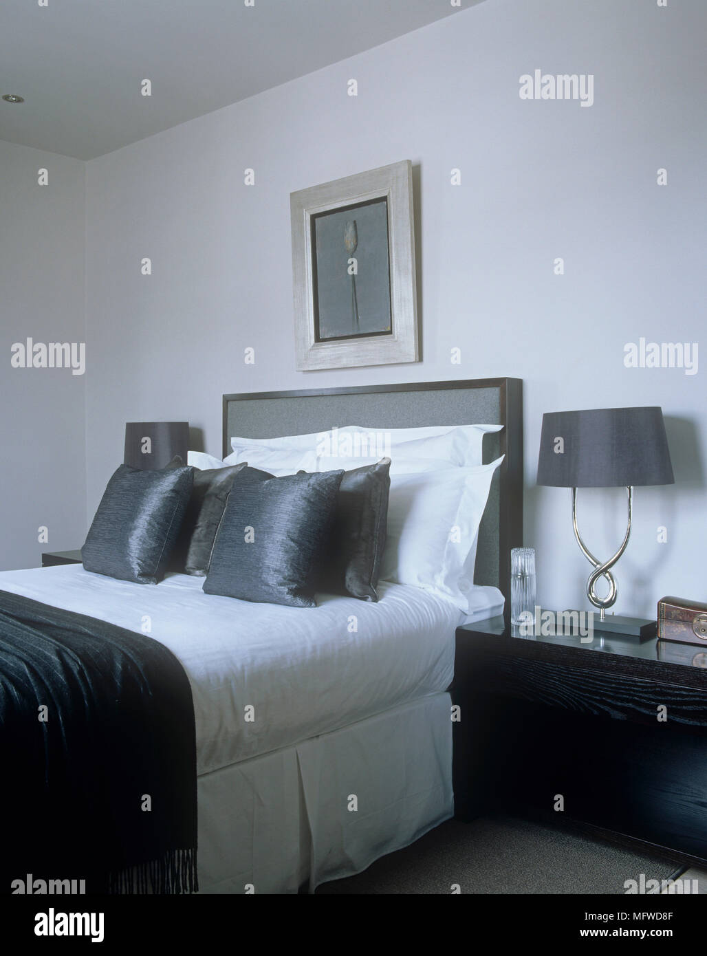 Bedroom with artwork above bed Stock Photo - Alamy