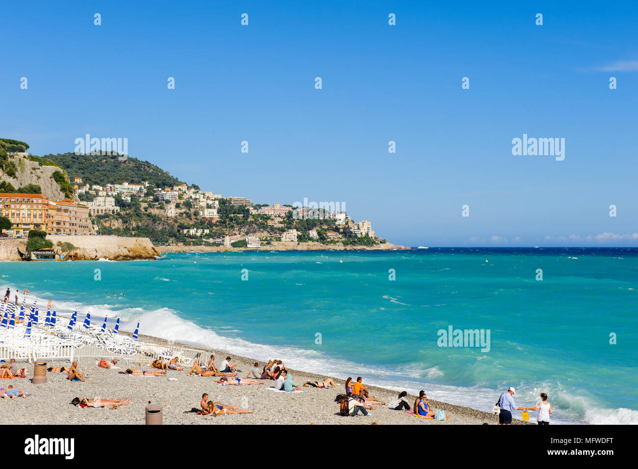 Beach of the Mediterranean sea, Cote d Azur, Nice, France. Nice is the capital of the Alpes Maritimes departement Stock Photo