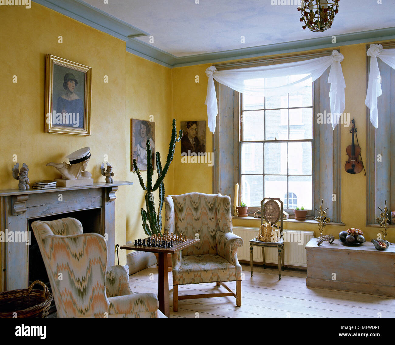 Country Style Yellow Sitting Room Fireplace And Upholstered