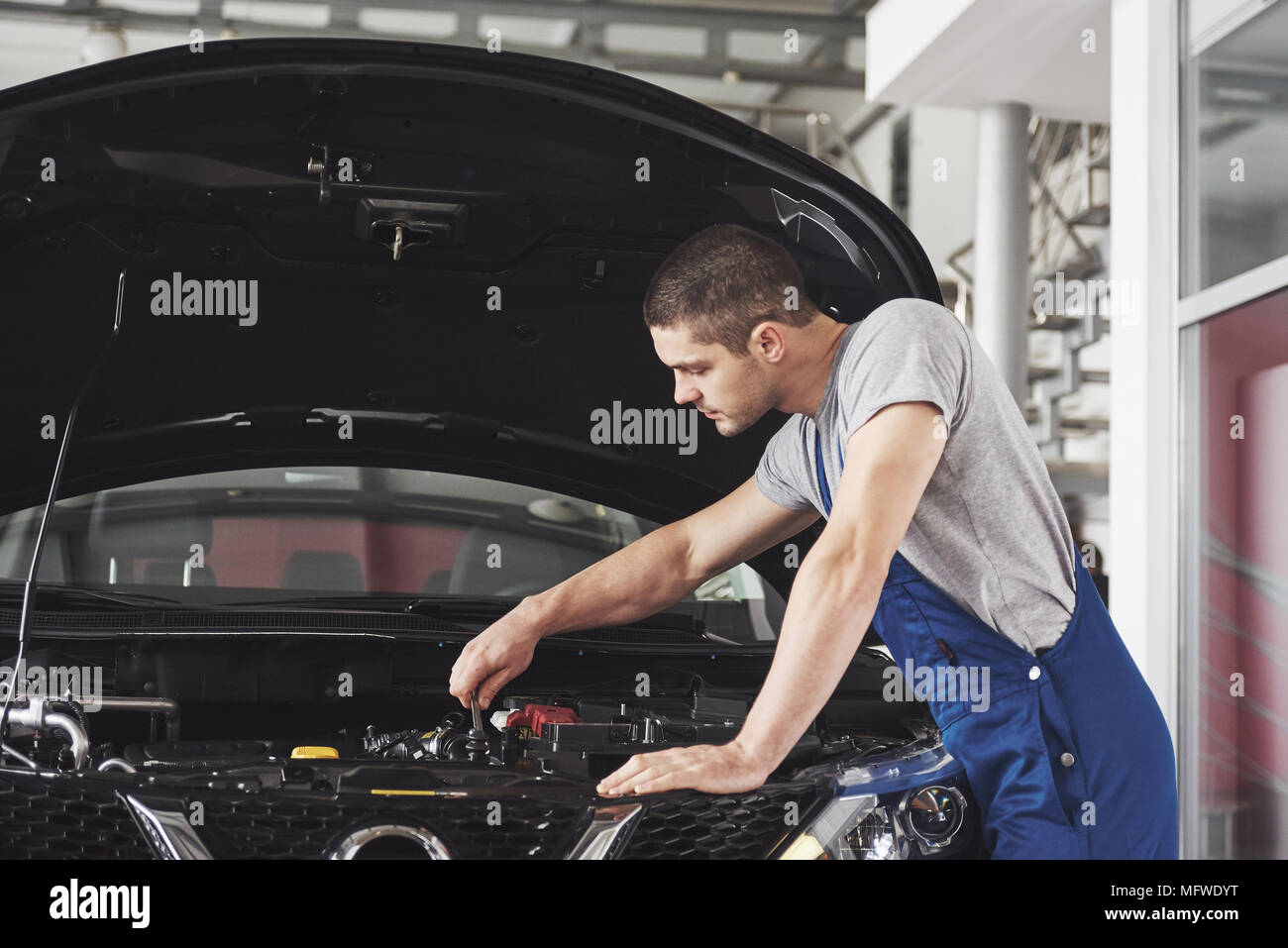 Auto mechanic working in garage. Repair service Stock Photo Alamy