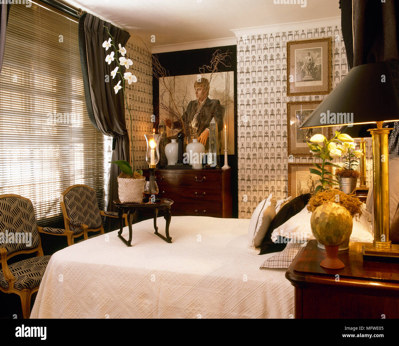 Double Bed In Bedroom With Pattern Wallpaper And Venetian Blinds
