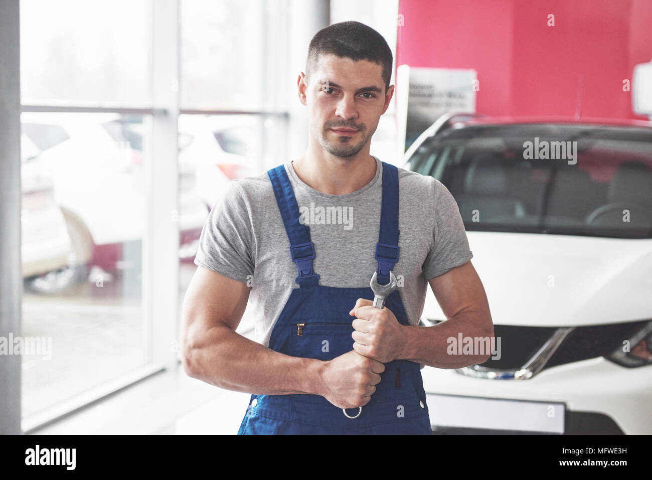 Hand of car mechanic with wrench. Auto repair garage Stock Photo Alamy