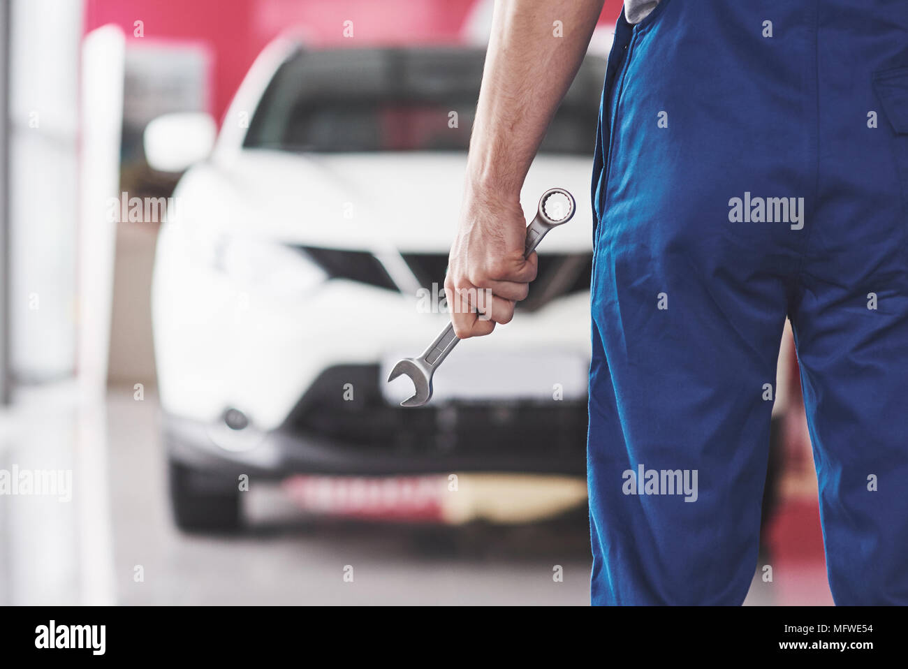 Hand of car mechanic with wrench. Auto repair garage Stock Photo Alamy