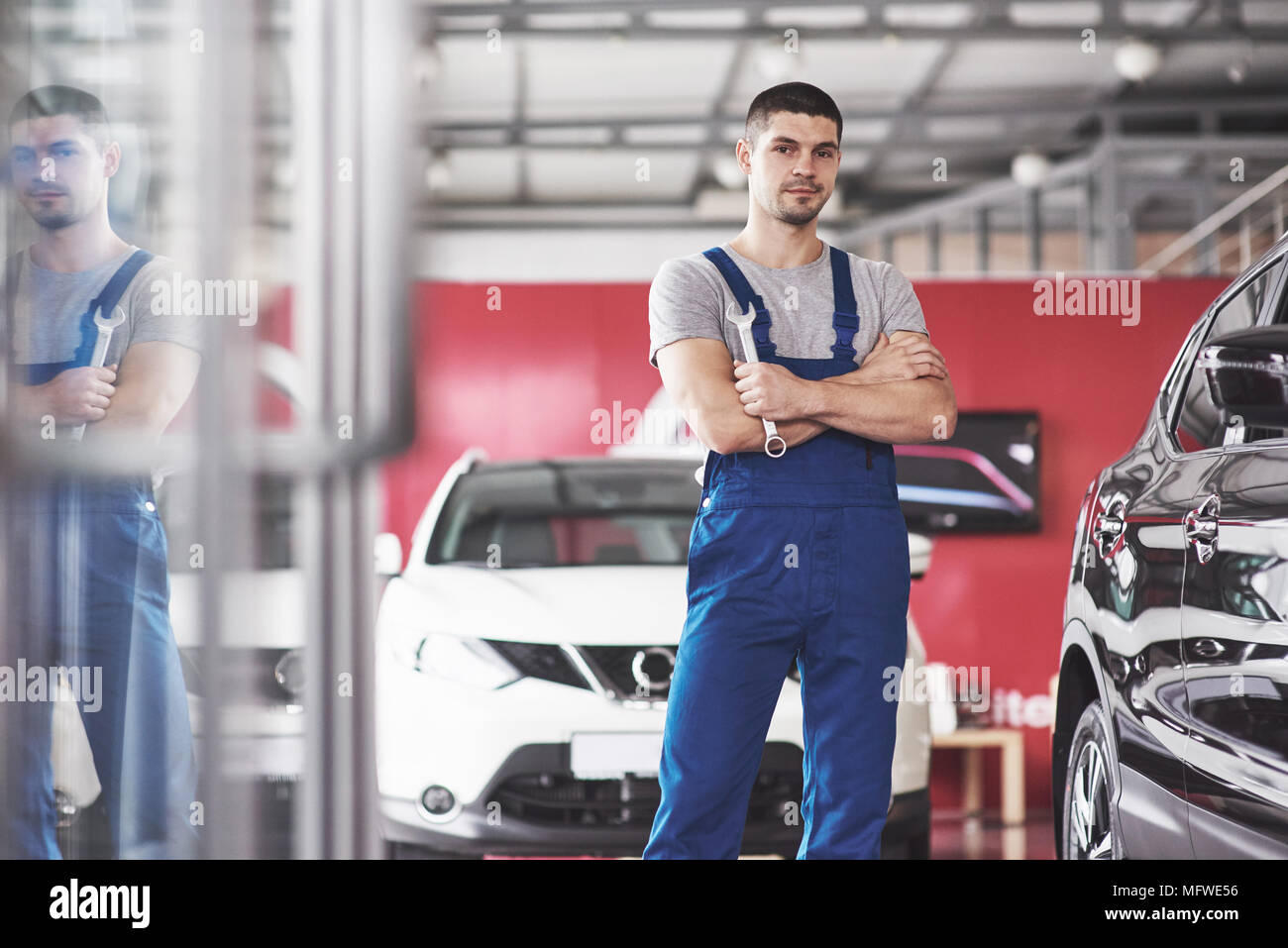 Hand of car mechanic with wrench. Auto repair garage Stock Photo Alamy