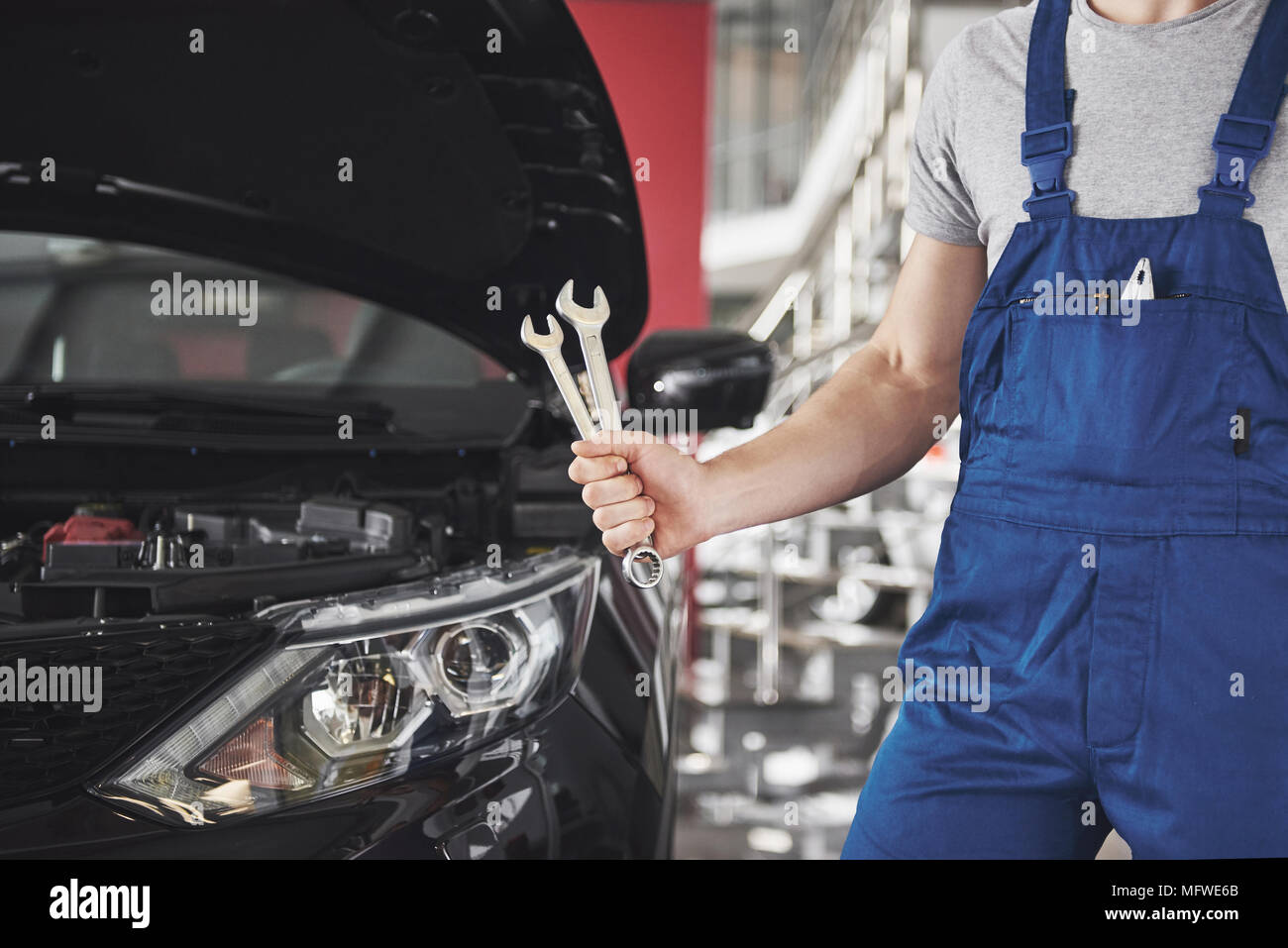 Hand of car mechanic with wrench. Auto repair garage Stock Photo Alamy