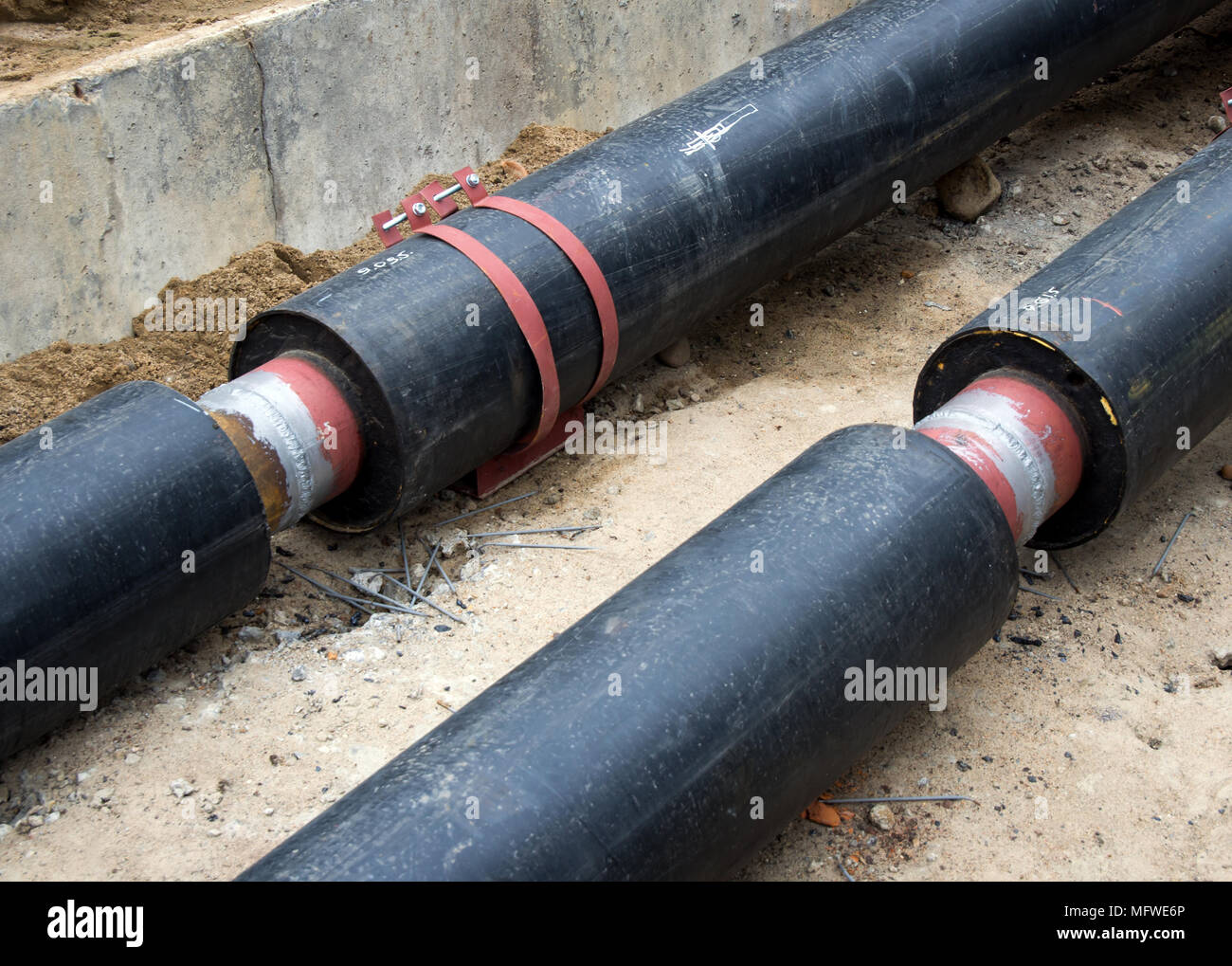 Preparation of new heating pipes for trenching Stock Photo Alamy
