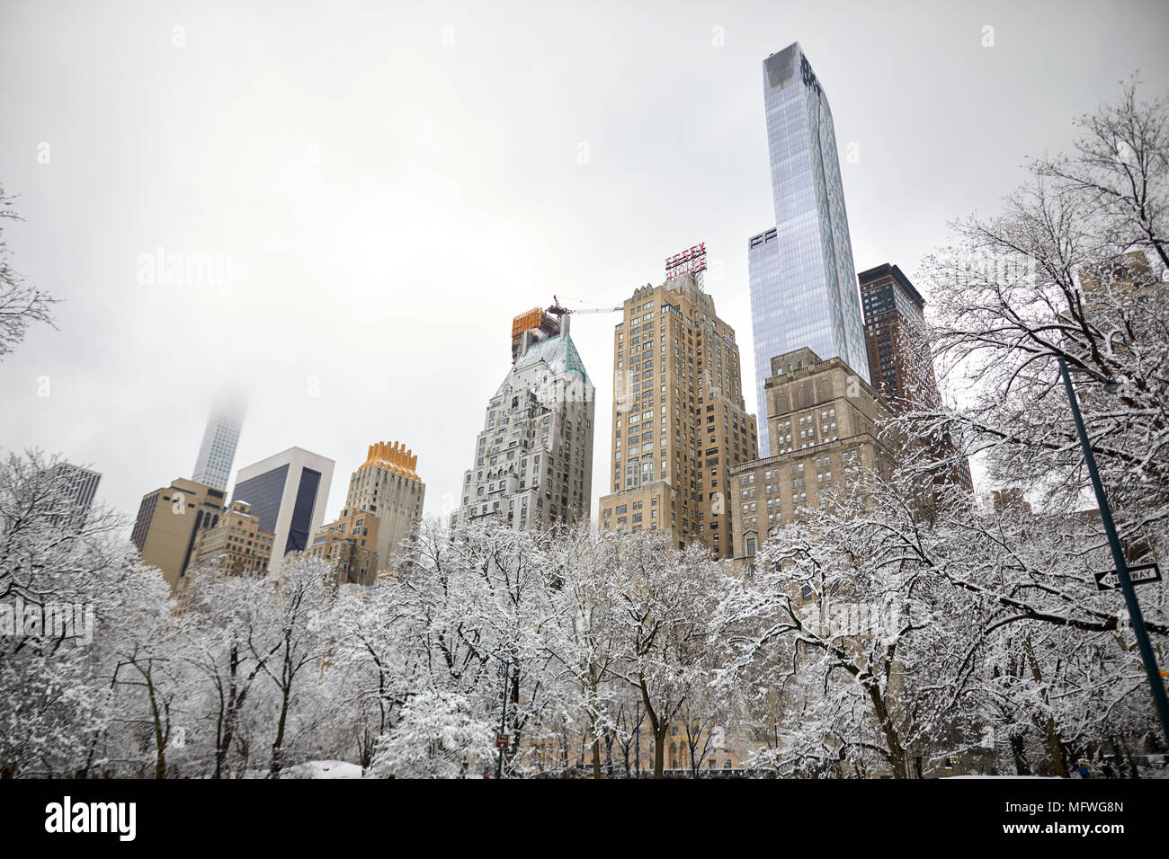 Manhattan in New York City  Easter snow covers Grand Central Park, skyscrapers through the trees Stock Photo