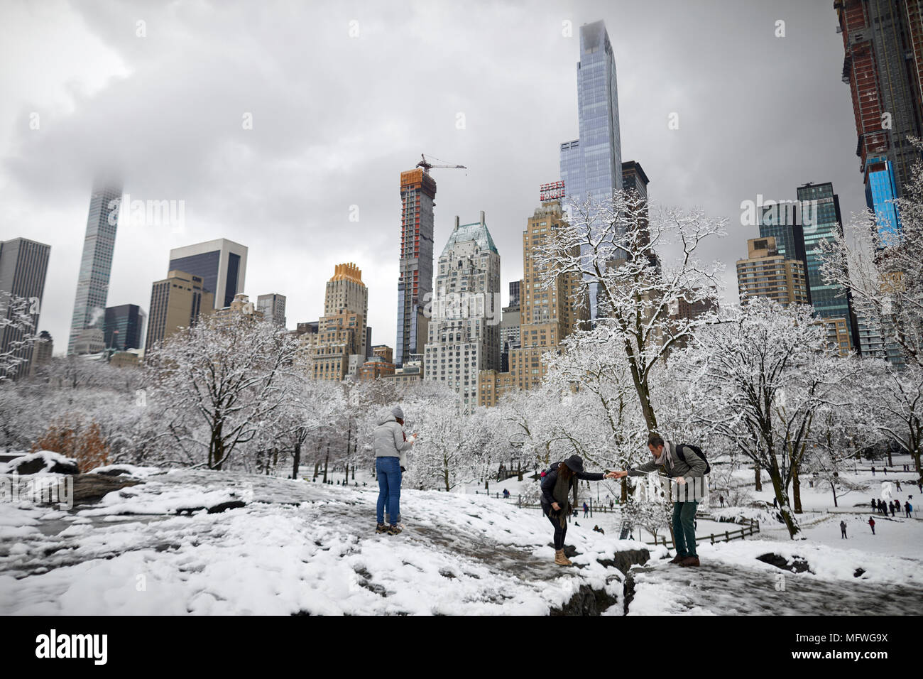 Manhattan In New York City Easter Snow Covers Grand Central Park Skyscrapers Through The Trees At Umpire Rock Stock Photo Alamy