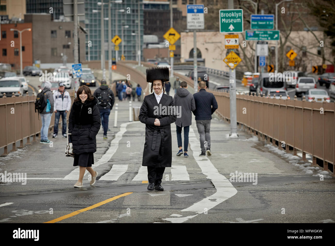 Brooklyn in New York City, Orthodox Judaism wearing shtreimel fur hat  Jewish holiday Pesach passover on Brooklyn Bridge Stock Photo