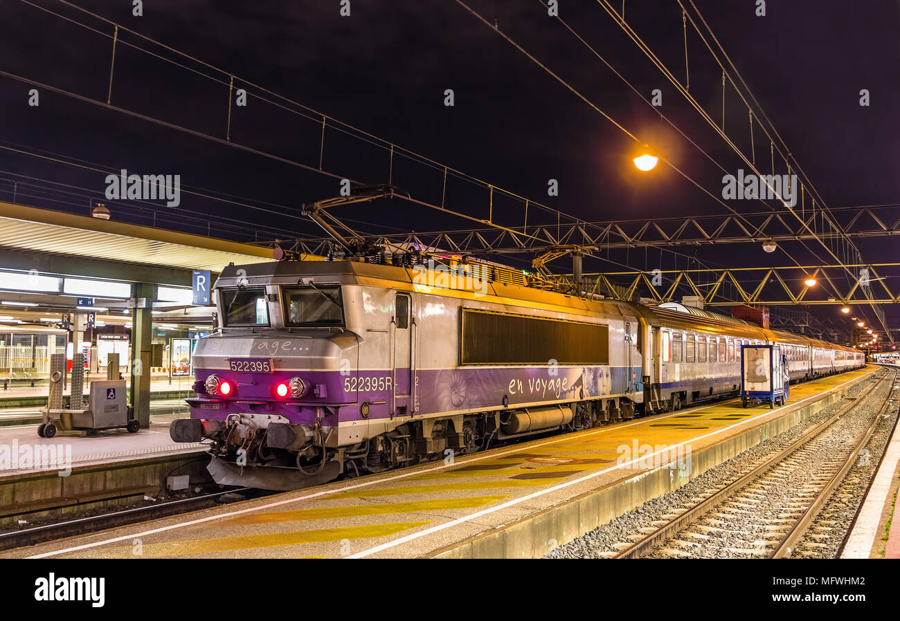 LYON, FRANCE - JANUARY 07: Electric locomotive with a regional t Stock Photo