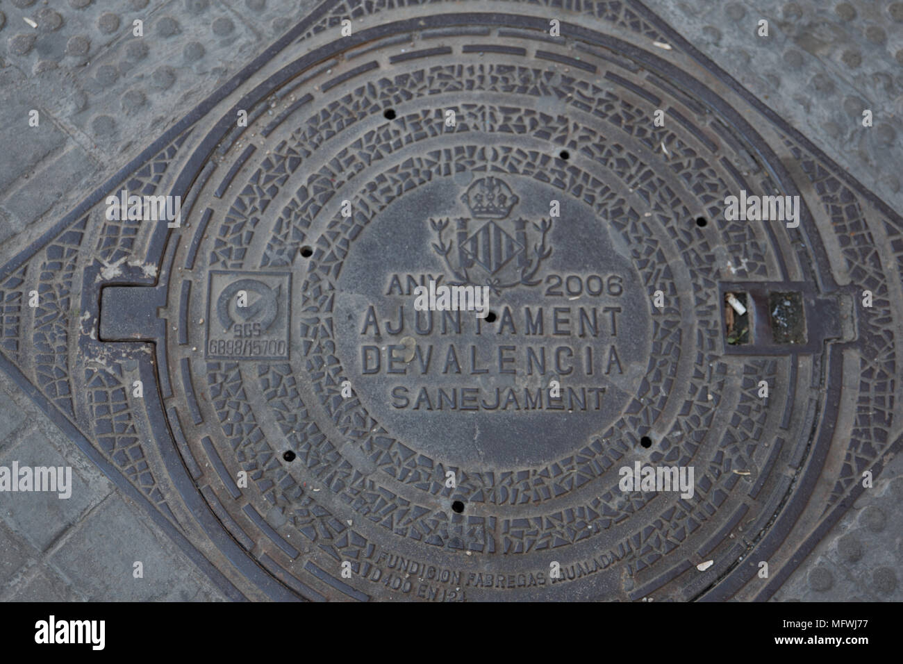 Round manhole cover in Valencia Spain Stock Photo