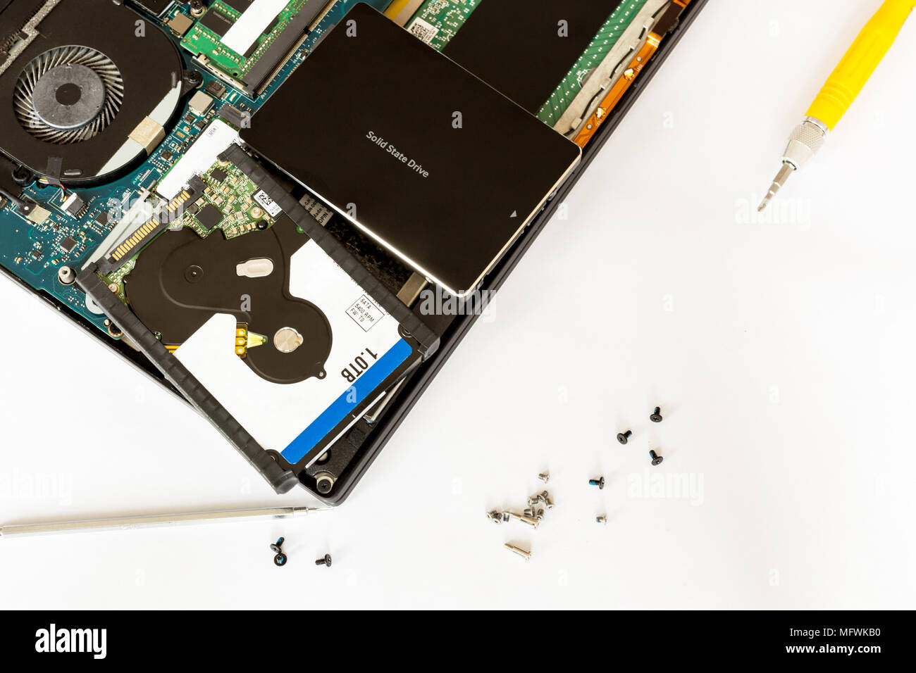 Hdd disk and solid state drive over disassembled notebook at electronic  service center. Replacement of hardware computer part. Advantages of SSD  technology. PC repair , fix and upgrade Stock Photo - Alamy