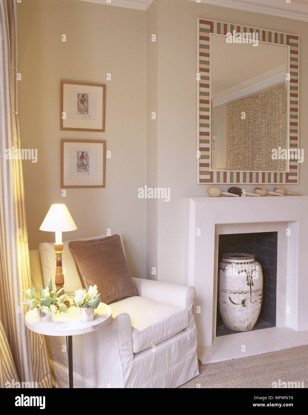 Upholstered Armchair Next To Fireplace In Neutral Colour Sitting