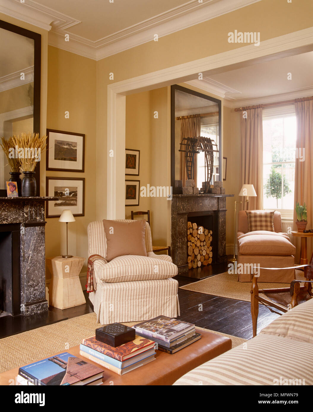 Upholstered armchair in front of fireplace in traditional style sitting