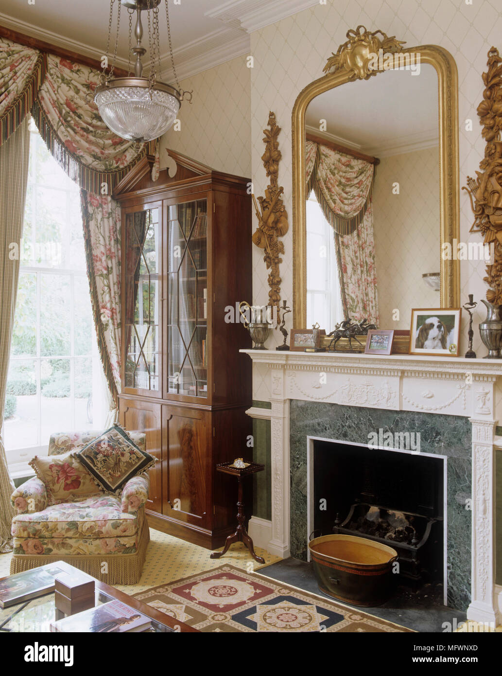 Bookcase In Recess Next To Ornate Fireplace Stock Photo 181889525