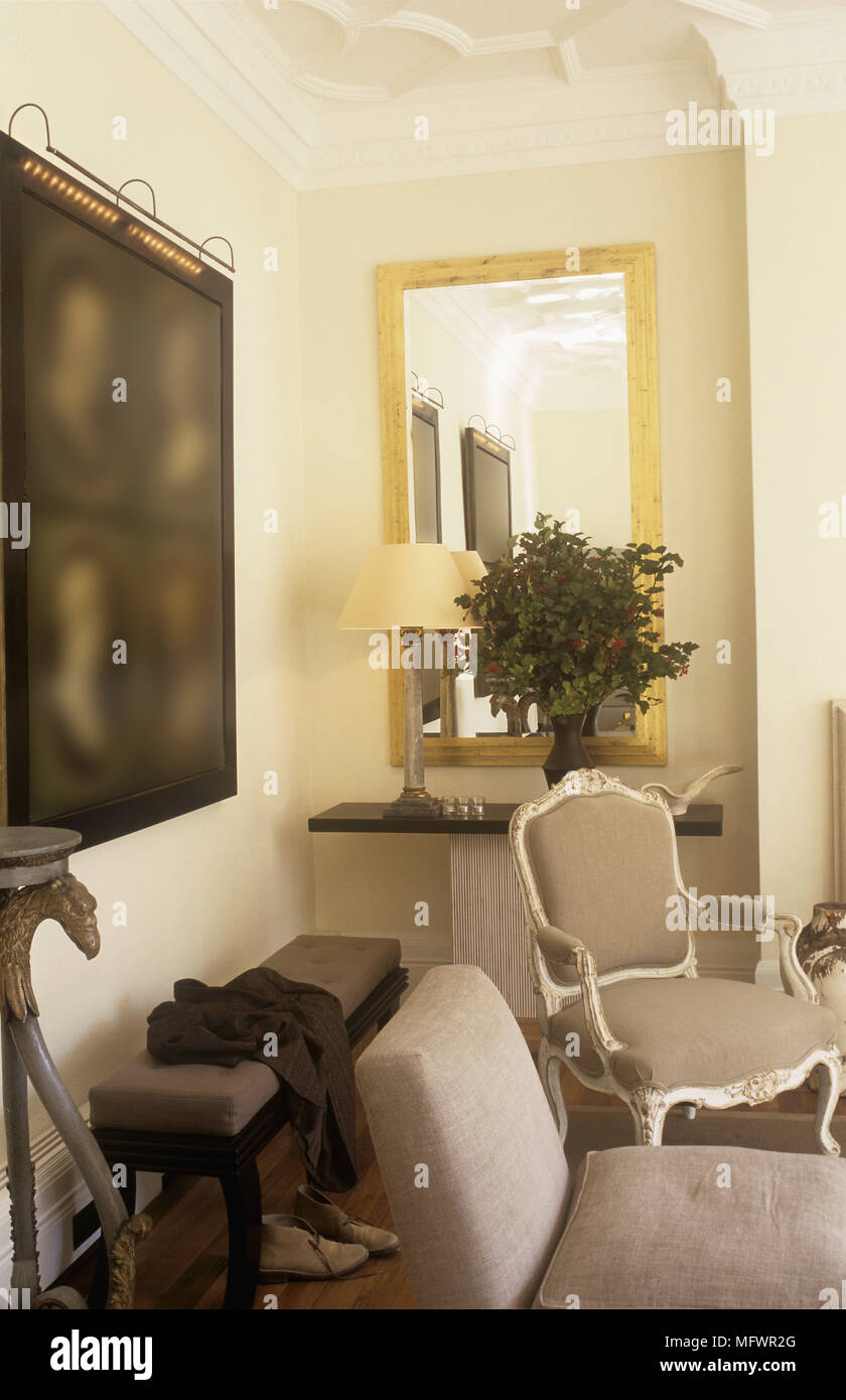 Bench And Chairs In Room Corner With Mirror And Artwork On Wall