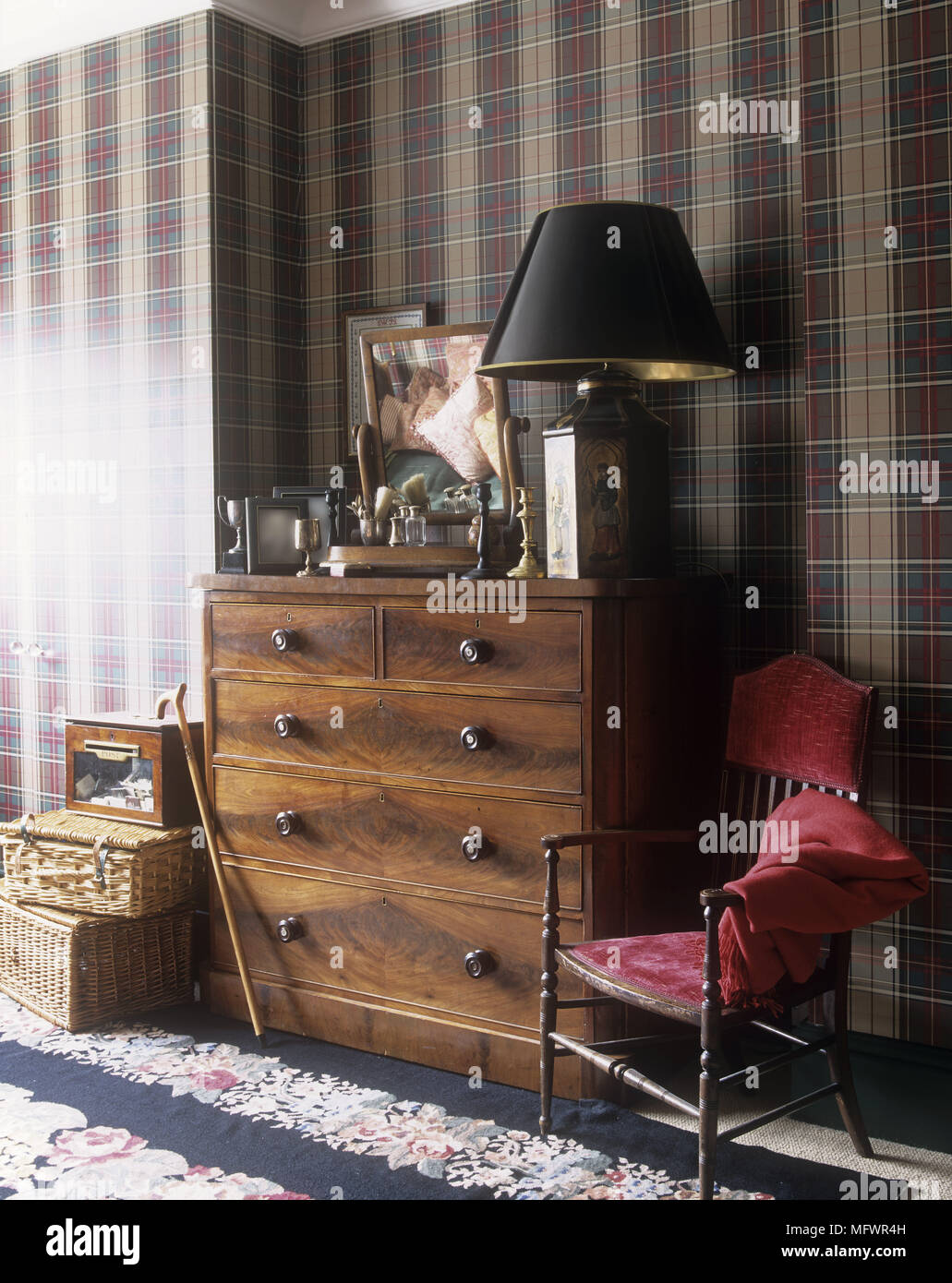 Wooden Chest Of Drawers With Ornaments Next To Chair With Red