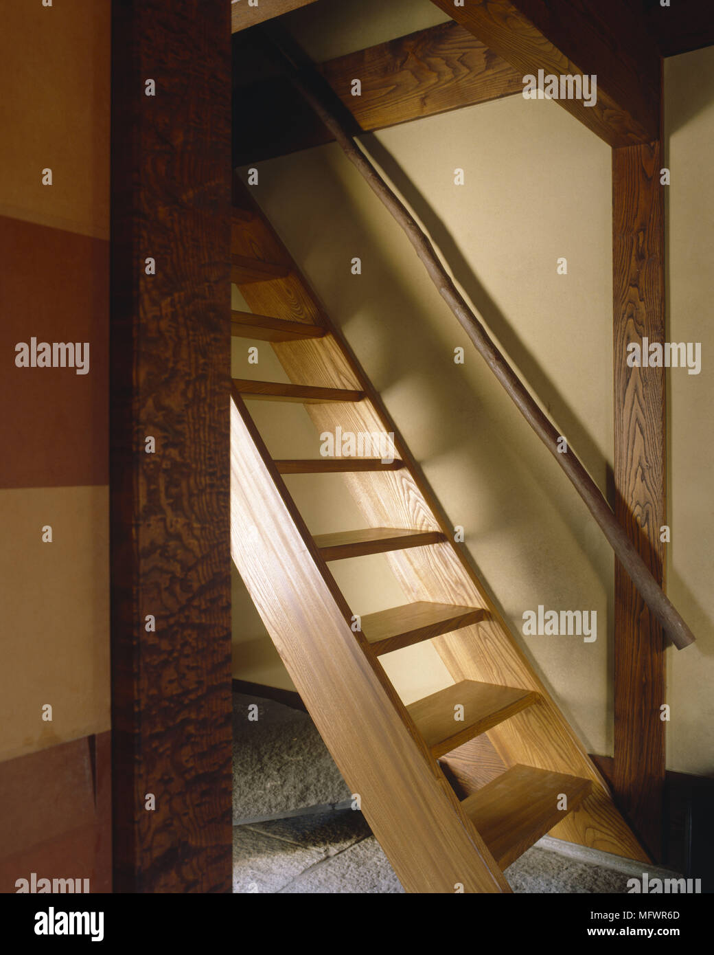 Steep Wooden Staircase With Rustic Hand Rail Stock Photo