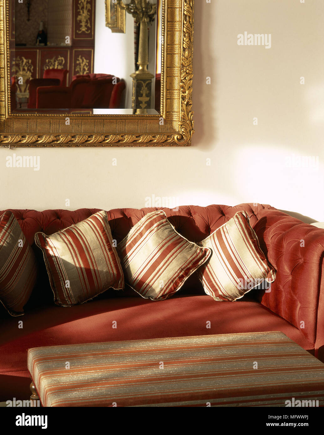 View of an antique mirror above a couch Stock Photo - Alamy
