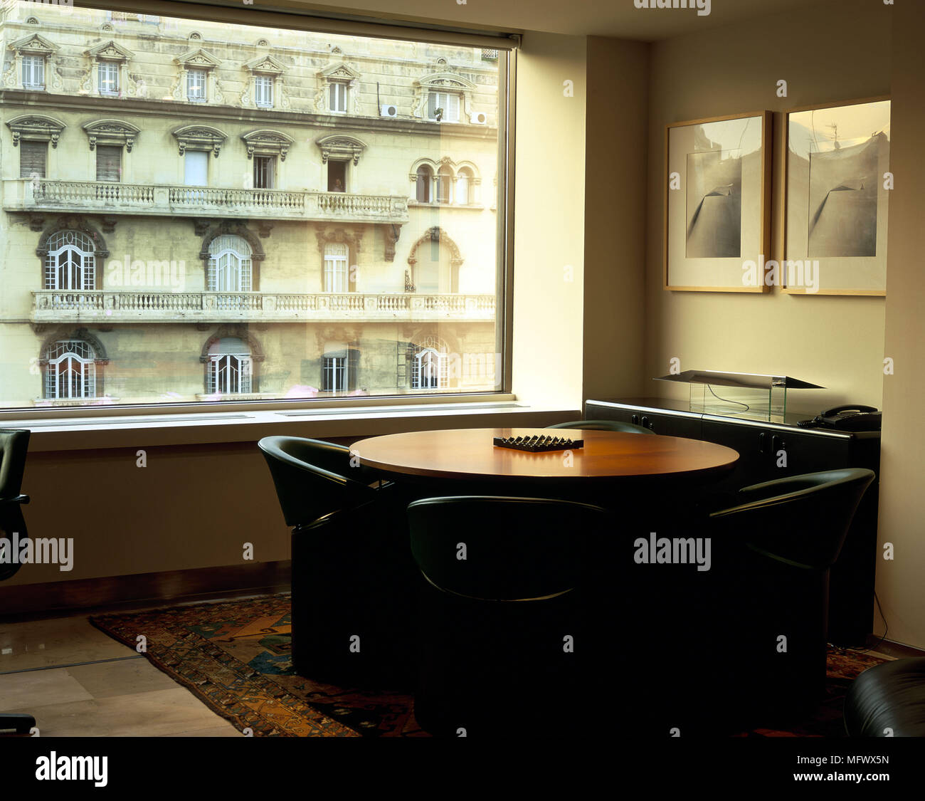 View of an office set with a round table and chairs Stock Photo Alamy