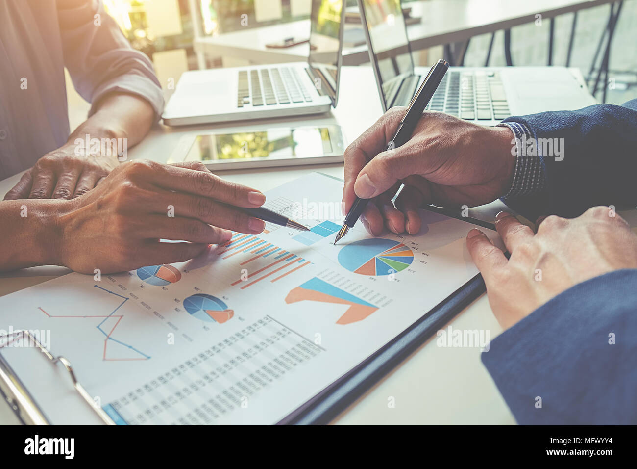 Business concept. Business people discussing the charts and graphs ...