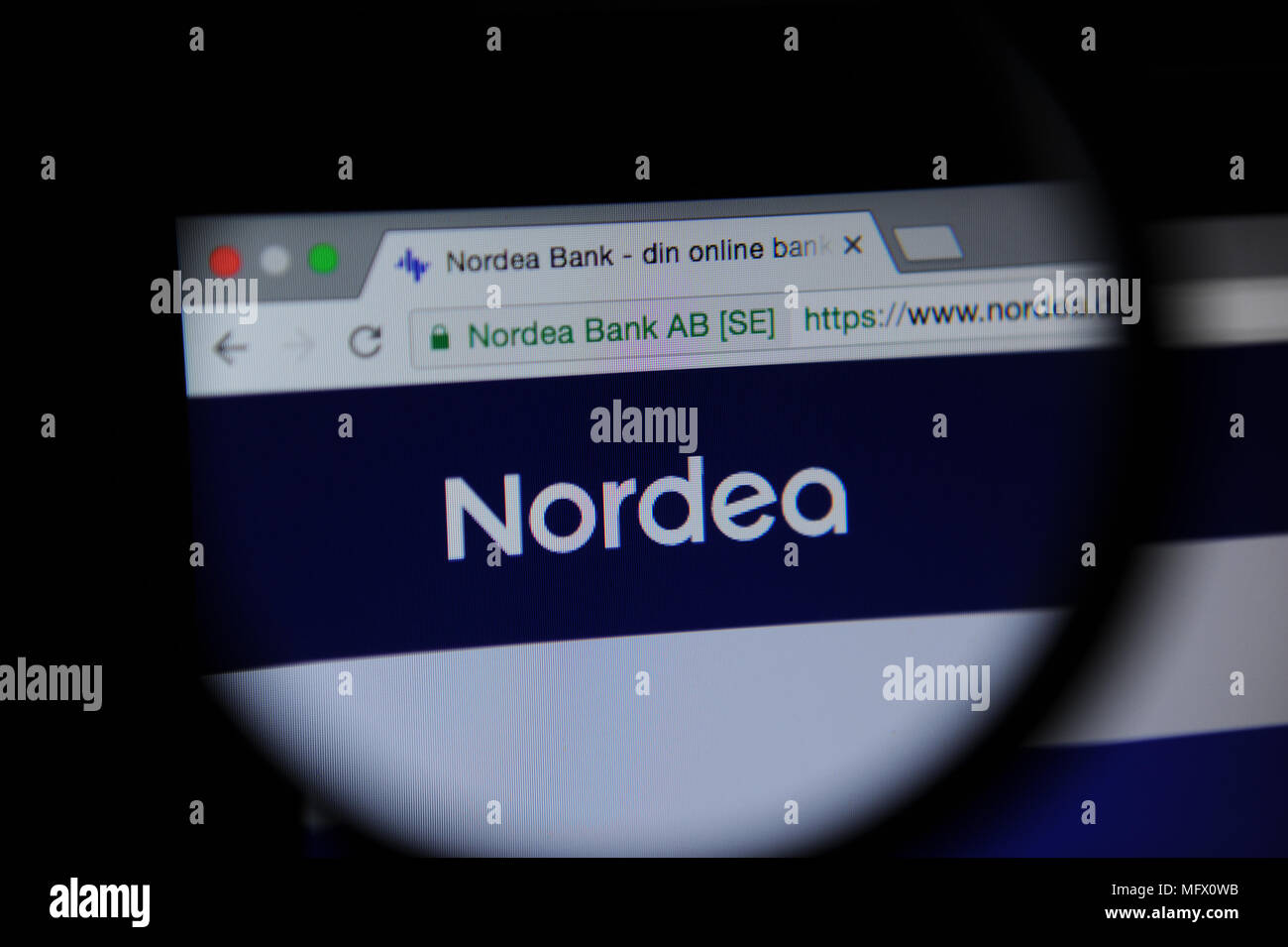 Nordea website seen through a Magnifying glass Stock Photo