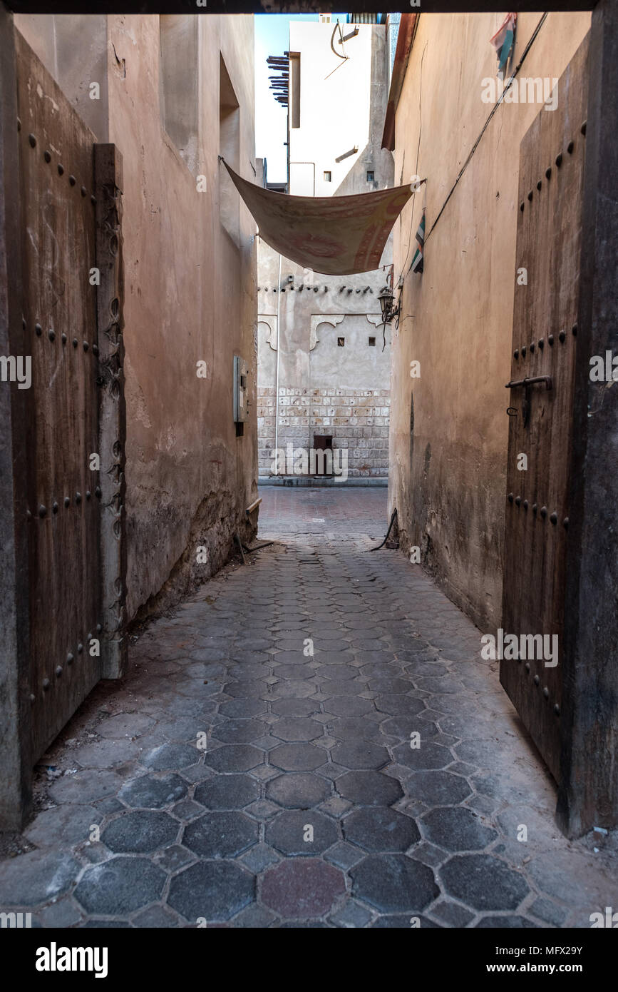 Old narrow street in old town Dubai Stock Photo