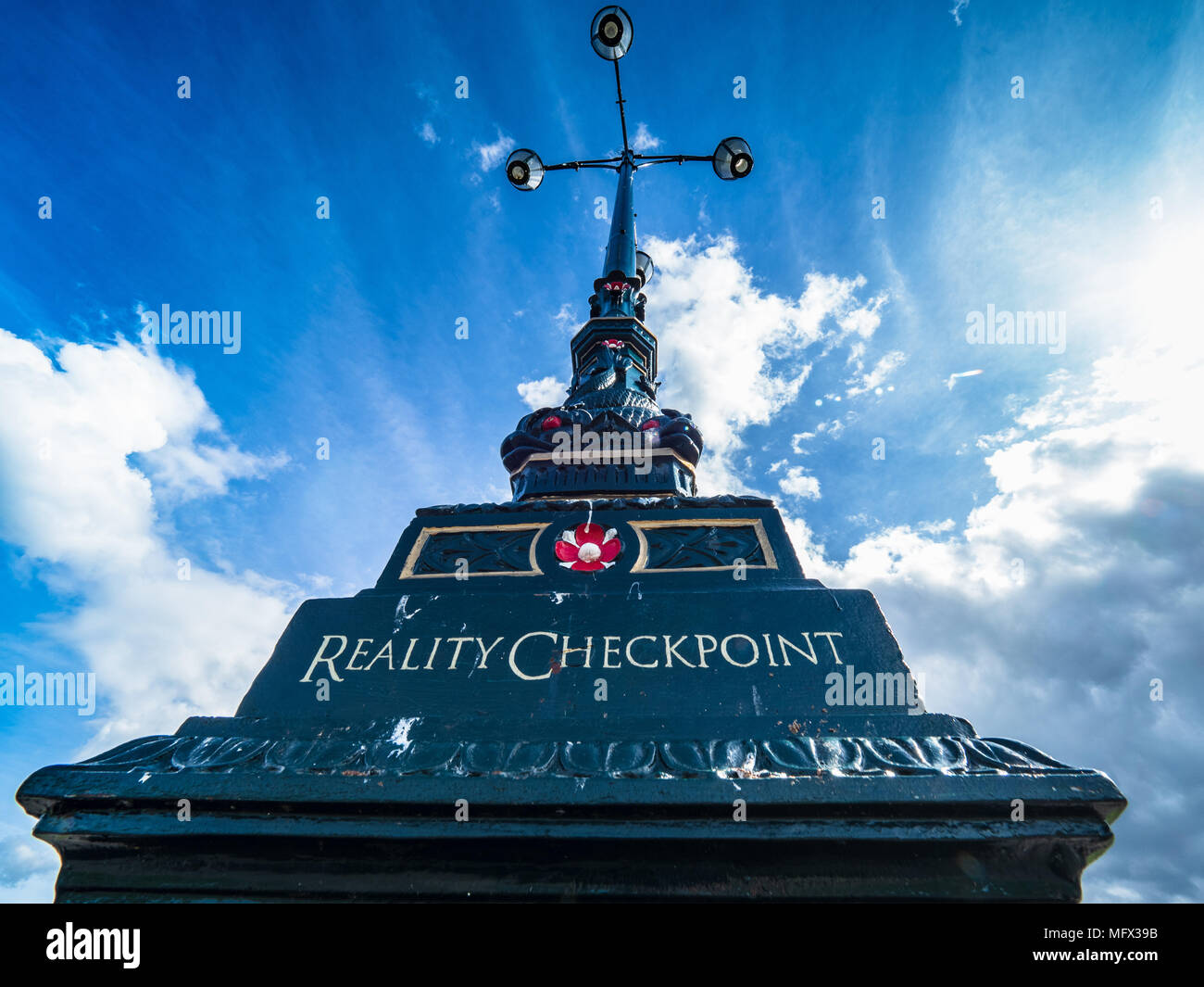 Reality Checkpoint - cast iron lamppost on Parkers Piece said to mark the end of the fantasy city of Central Cambridge and the start of the real city Stock Photo