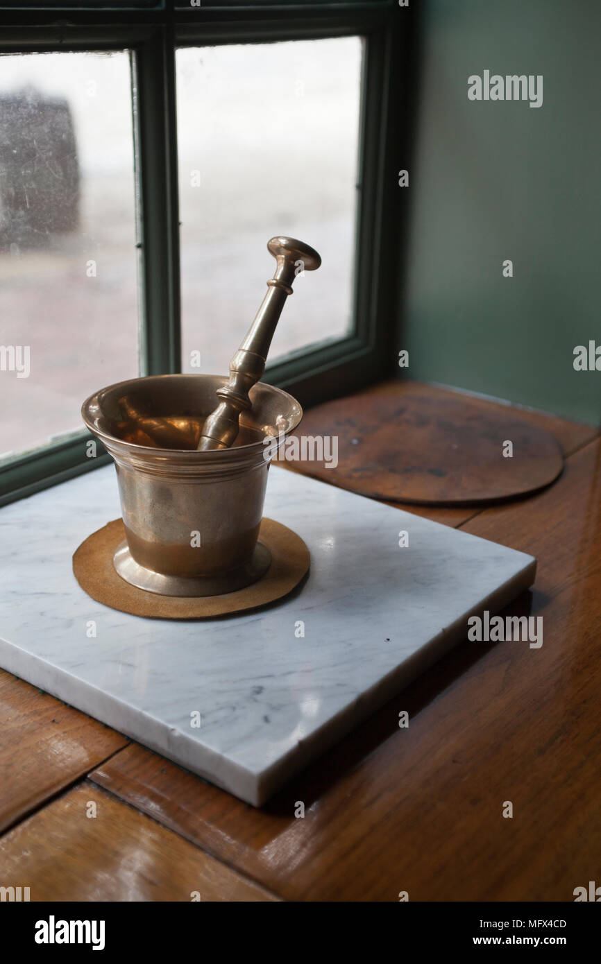 Still life of a mortar and pestle in a restored apothecary, colonial