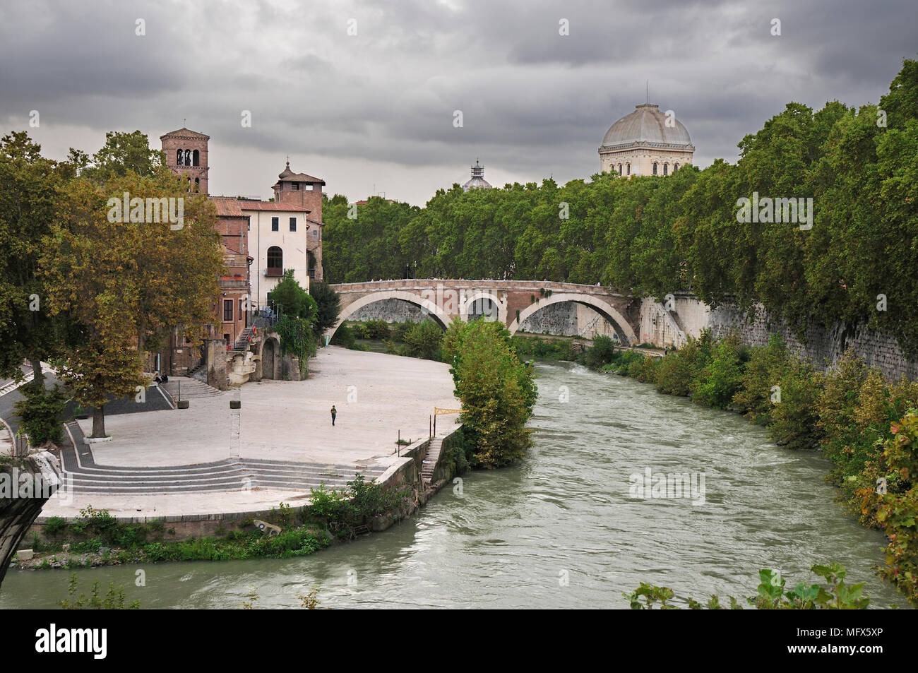 Tiber island (Isola Tiberina) and an old bridge over the river Tiber. Rome, Italy Stock Photo