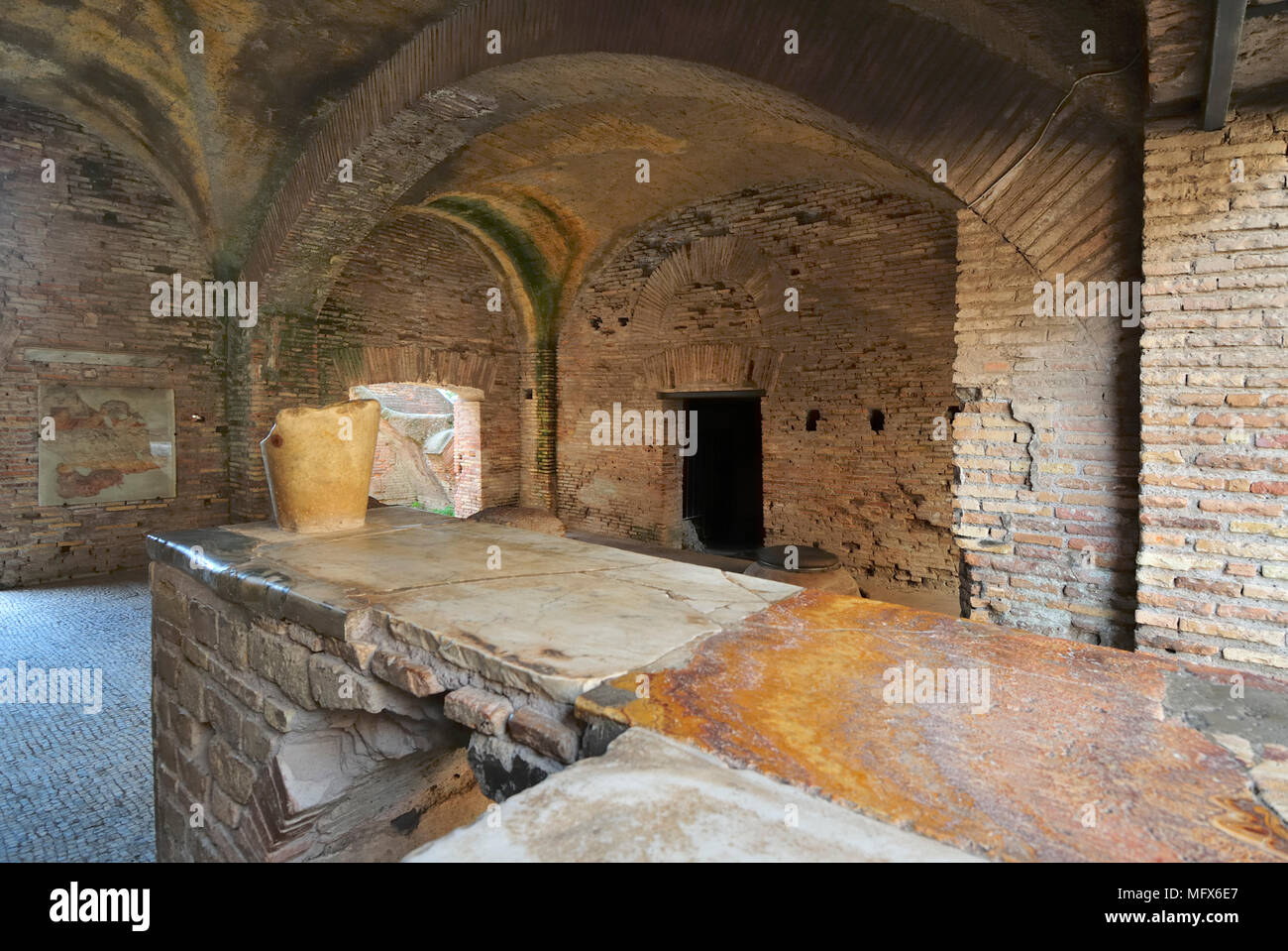 The Thermopolium in front of the House of Diana. The Thermopolium was an ancient roman café where were served hot wine with honey and some food, Ostia Stock Photo