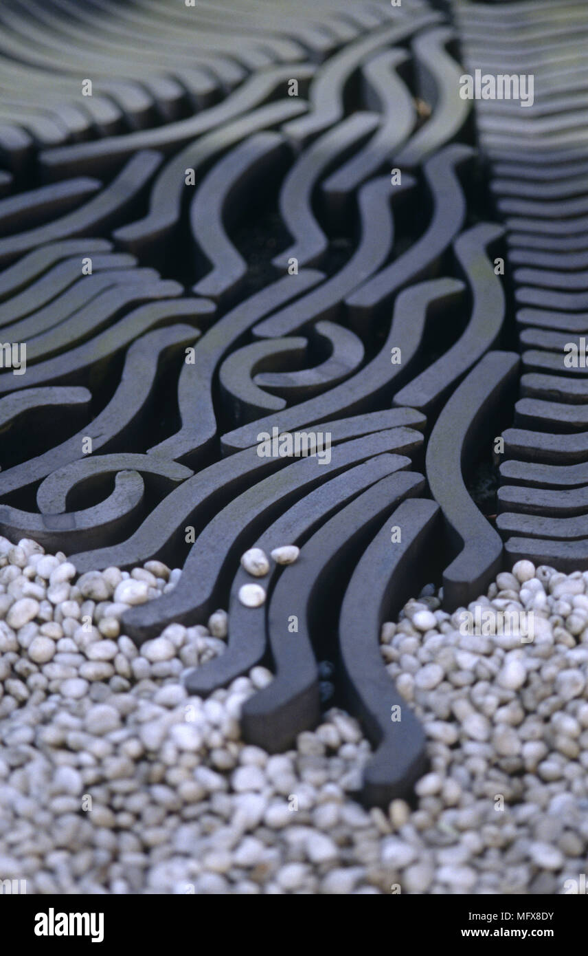 Decorative iron grill set in gravel Stock Photo Alamy