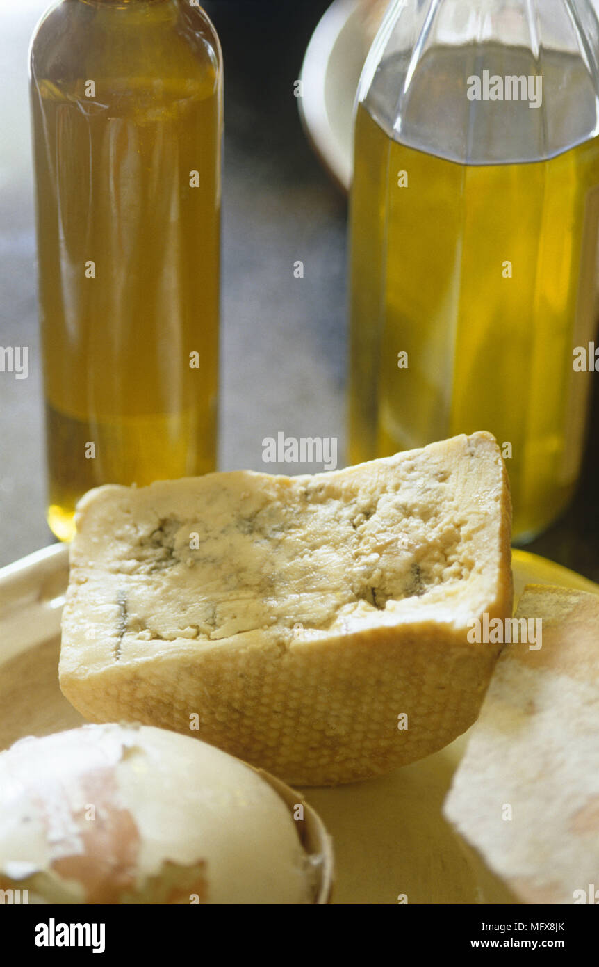 Cheese and bottles of oil Stock Photo Alamy