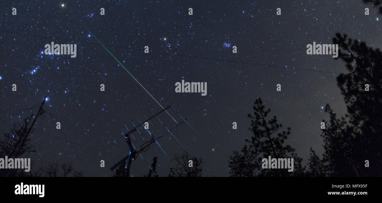 Geminid meteor over ham radio satellite antenna, Oregon, Ashland, Cascade Siskiyou National Monument, Taken 12.2017 Stock Photo