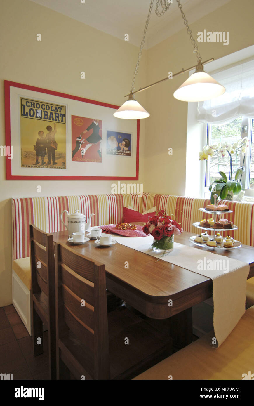 Ceiling Lights Above Wooden Table With Stripe Pattern Banquette
