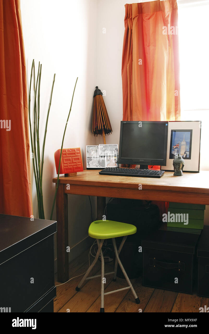 Laptop on desk in modern room Stock Photo