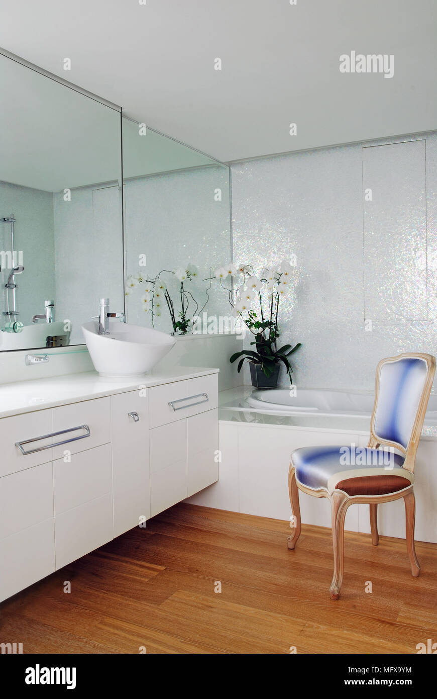 Washbasin on cupboard unit in modern ensuite bathroom Stock Photo