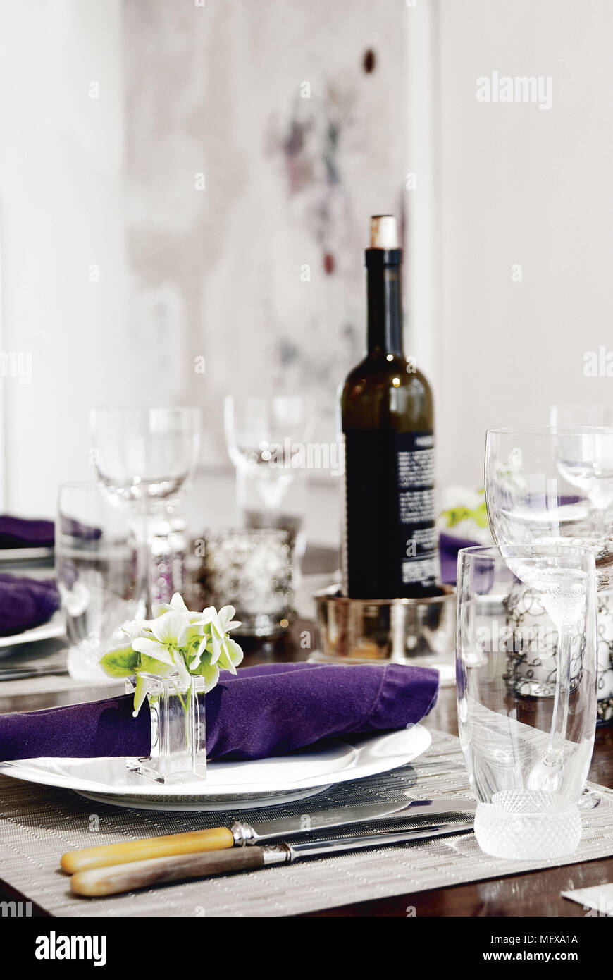 Place setting with purple napkin Stock Photo