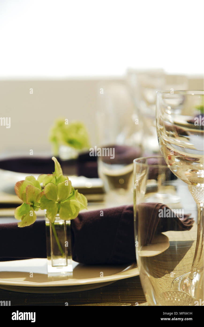 Place setting with purple napkin Stock Photo